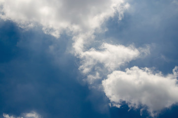 Blue sky with white cloud and partial dark clouds. Sky cloud. 