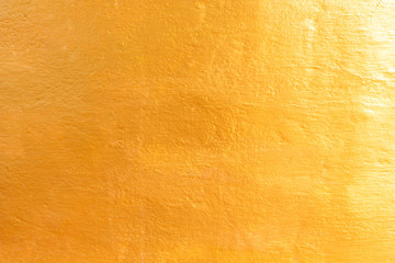 Gold color concrete on background texture.