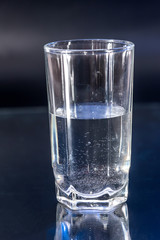 Glass of water isolated on black background