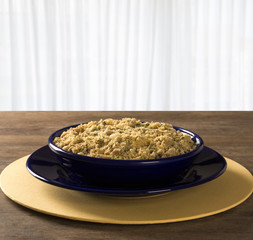 Farofa - toastef manioc flour and pork - traditional Brazilian side dish.