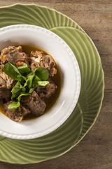 Brazilian traditional food called oxtail with arugula