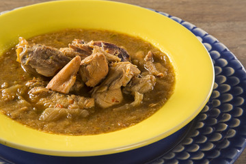 Fish pirão with pieces of chicken from angola