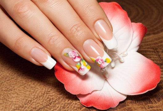 Nail extensions. Manicure and flower painting. Isolated.