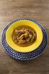 Fish pirão with pieces of chicken from angola
