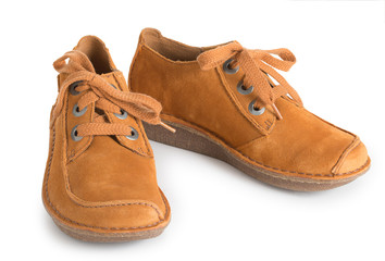 Pair of fashion stylish chamois leather shoes for women, isolated on a white background close up.