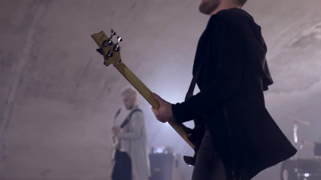 Two rock and roll guitarist and drumer playing live underground