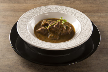 Rustic Stew meat with sauce in the white plate