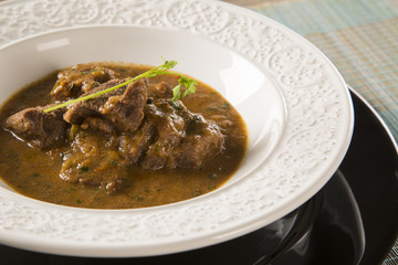 Rustic Stew meat with sauce in the white plate