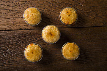 Empada Brazilian snack. pie with shrimp on wooden background