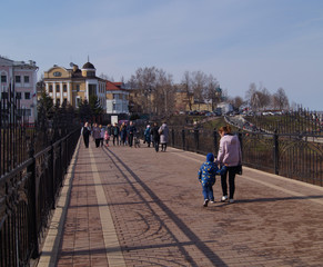 Walking along the pedestrian zone in the warm spring weekend