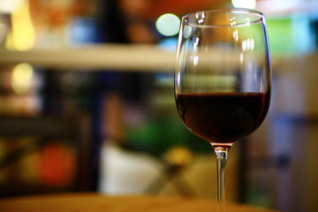 Serving a glass of red wine in a restaurant