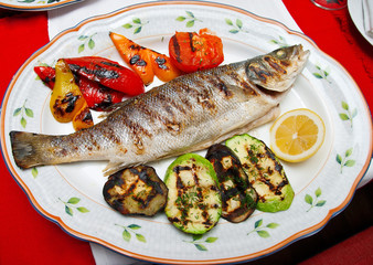 Grilled vegetables and fish on a plate