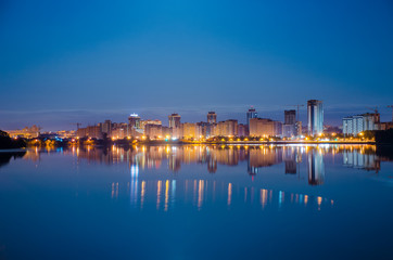 Reflection of the night city on the water surface.