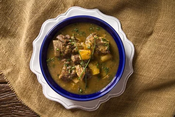 Poster rustic Stew meat with manioc called Vaca atolada in Brazil. © paulovilela