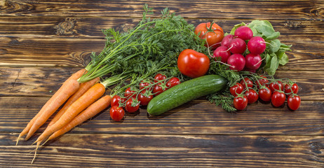 Fresh vegetables on a wooden background. 