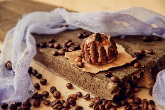 Chocolate cupcakes with coffee beans on dark background, AF point selection.