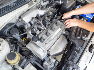 Car mechanic working in auto repair service