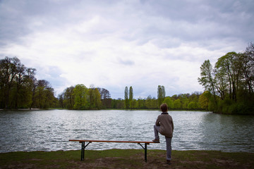 The boy walks in garden