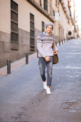 Confident and handsome young man in the street