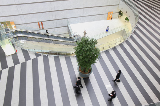 Aerial View Of Businessman Walking At Modern Building Lobby
