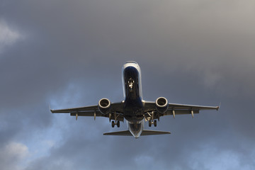 Passenger airplane low in the sky preparing to land