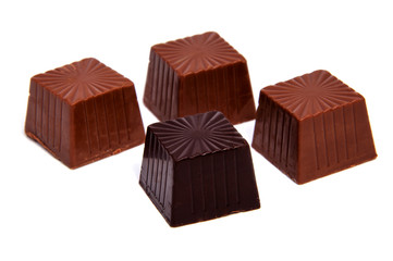 Delicious chocolate candy, isolated on white .