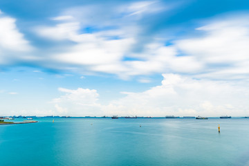 Fototapeta na wymiar Singapore Seascape From Marina Barrage with Cargo ship and Sky