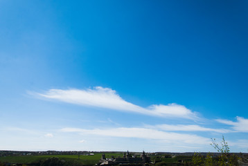 Fototapeta na wymiar Beautiful blue sky with silhouette of Ukrainian castle