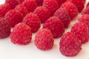 Raspberry on a white background close up