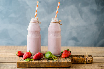Strawberry smoothie or milkshake in a bottles