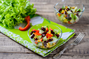 Fresh spring salad with sweet pepper, cucumbers and haricot