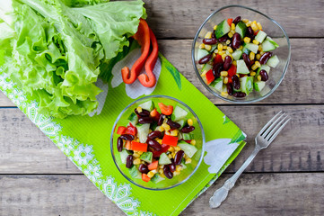 Fresh spring salad with sweet pepper, cucumbers and haricot