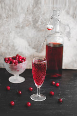 glass of homemade sparkling cherry wine