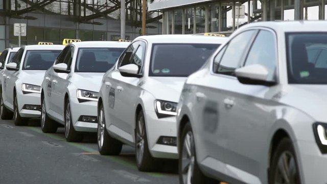 The queue of the white cab near the airport, unrecognizable, Europe Prague, hd 1080p