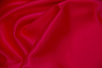 Red cloth waves background texture.