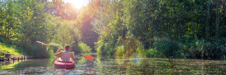 Girl in a kayak and sunny weather, panorama - obrazy, fototapety, plakaty
