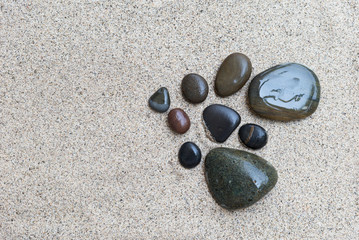 Fototapeta na wymiar Natural stone on white sand background