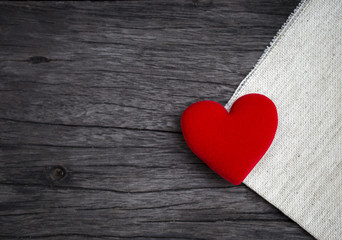Red heart over vintage wooden texture background, love concept, valentine background