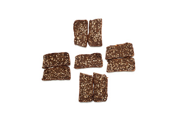 Black bread with seeds on white background
