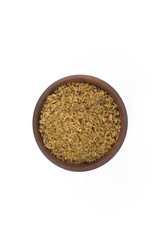 Freekeh in a wood bowl in white background seen from above