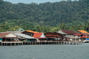 Fototapeta na wymiar Fishing village with houses near the sea shore