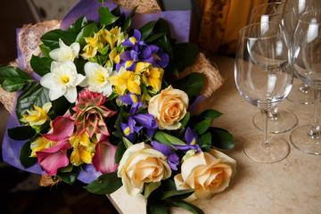 Bouquet of flowers lies on table