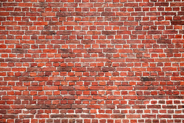 Pattern of red stone blocks. Brickwall texture close up view. Wall of red small bricks.