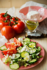 Tasty Greek salad with lettuce, cherry tomatoes and feta cheese