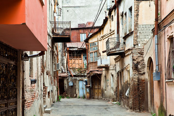 Fototapeta na wymiar Neighborhood with old crumbling houses in Tbilisi, Georgia
