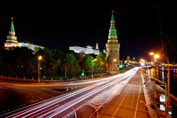 Fototapeta na wymiar Moscow Kremlin at night. Embankment with car traffic view