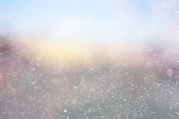 Snowfall texture of snowflakes on blurred background