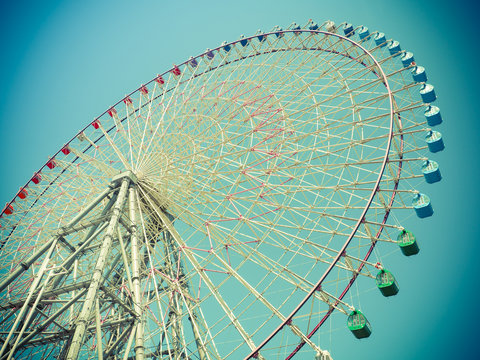 Vintage color filter, Giant Ferris wheel against the Sky