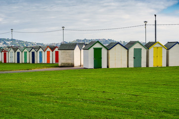 Colored houses on the beach, colorful door to summer cottages, seaside spot