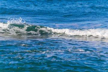 Small wave in the blue sea
